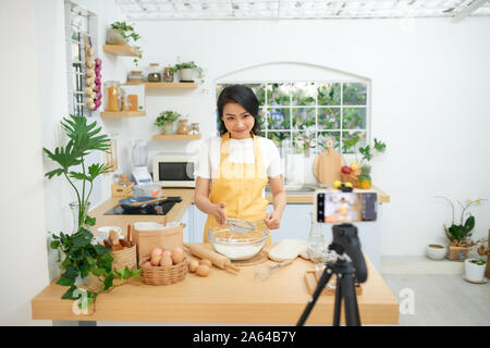 Young asian woman recording video for her blog Stock Photo