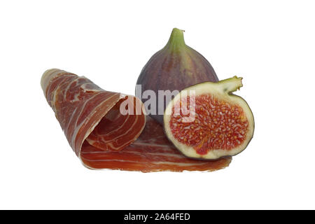 Dry cured ham and whole and sliced figs isolated on white background Stock Photo