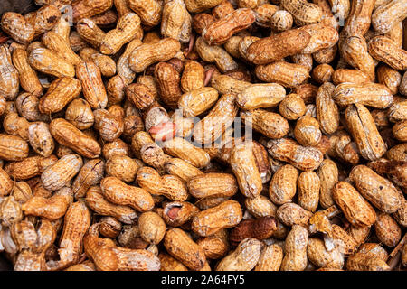 Natural raw peanuts in shell ideal as food allergy background Stock Photo