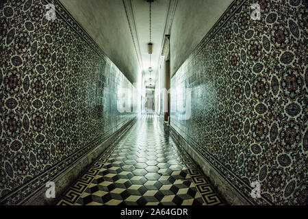 Vertiginously tiled long corridor at the University of Coimbra Medical School Stock Photo