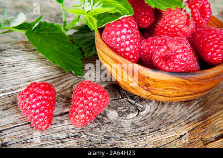 raspberries in olive bowl Stock Photo