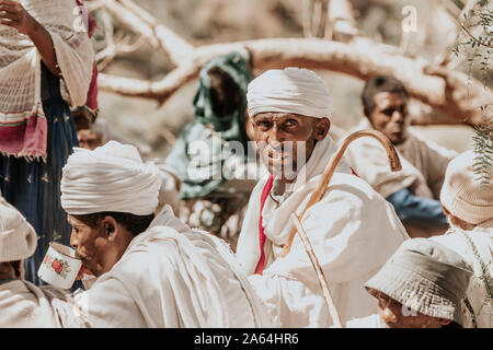 LALIBELA, ETHIOPIA, MAY 1st. 2019, Orthodox Christian Ethiopian believer in front of famous rock-hewn St. George's Church after Mass on May 1st. 2019 Stock Photo