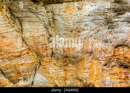 Ancient Aboriginal Art: hand prints, animal herds, spiral, australia Stock Photo