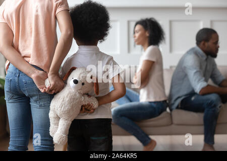 Unhappy black kids hold toy suffering prom home conflicts Stock Photo