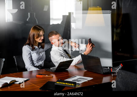 couple of employees take a selfie together at work Stock Photo