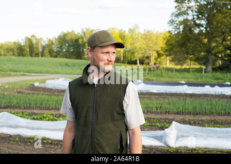 Portrait of a farmer standing in his garden Stock Photo