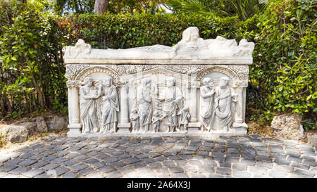 Beautiful marble decorated of ancient Roman white Sarcophagus, located in the Archaeological excavations of Ostia Antica,  Rome, Italy Stock Photo