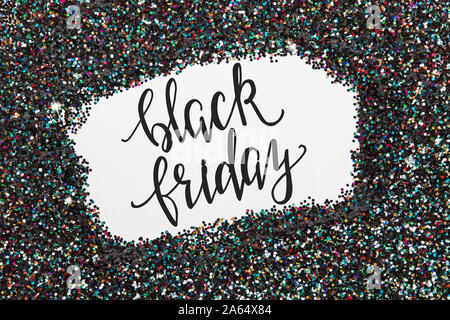 Balack holographic glitter texture with blank space in it and text black friday. Stock Photo