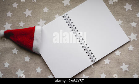 Notebook to write goals of new year on christmas background Stock Photo