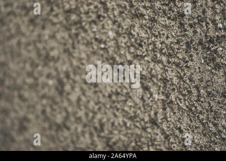 Close up background image of a regular textured old concrete wall, calm in its mild variations of grey Stock Photo
