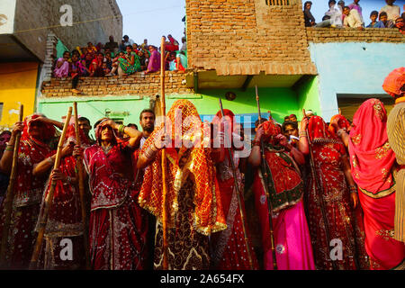 Women with sticks, Lathmar Holi festival, Mathura, Uttar Pradesh, India, Asia Stock Photo