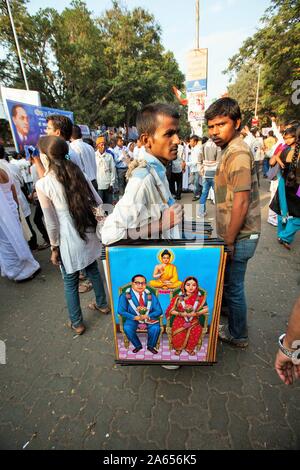 Hawker selling posters of Dr Babasaheb Ambedkar on pavement, Mumbai, Maharashtra, India, Asia Stock Photo