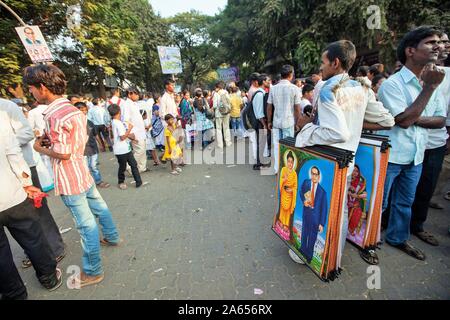 Hawker selling posters of Dr Babasaheb Ambedkar and Gautam Buddha, Mumbai, Maharashtra, India, Asia Stock Photo