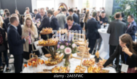 Abstract blured photo of business people socializing during banquet lunch break break at business meetin, conference or event Stock Photo