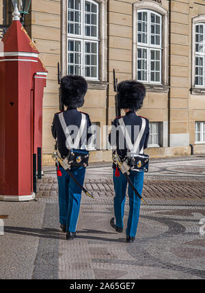 Two Guards on guard duty guarding Amalienborg or Royal Palace official residence of theDanish Royal Family in Copenhagen, Stock Photo