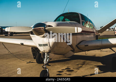 small airplane parked at airport in Sacramento Stock Photo