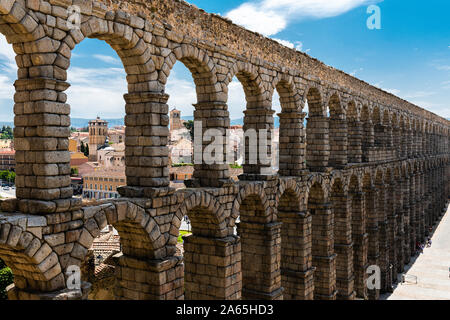 The Roman aqueduct in Segovia near Madrid in Spain Stock Photo