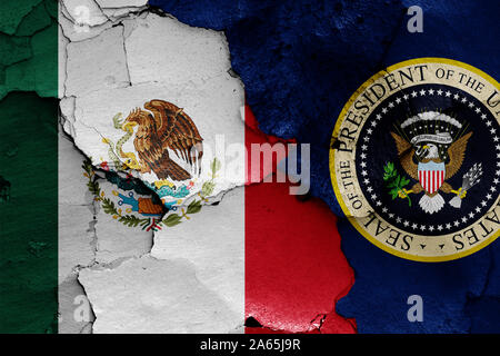 flags of Mexico and President of the United States painted on cracked wall Stock Photo