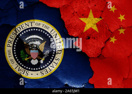 flags of President of the United States and China painted on cracked wall