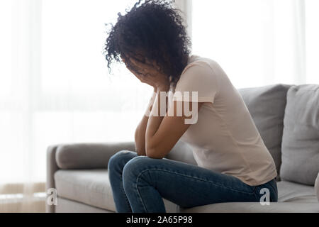 Stressed black woman crying having personal problems Stock Photo