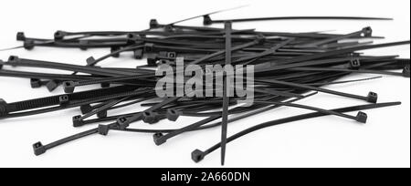 Very resistant black nylon flanges stacked in a pile on white background Stock Photo