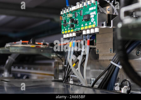 Computer aided printing process, advanced technology in the press and publishing sector, latest generation robotized plotting machines for newspaper. Stock Photo