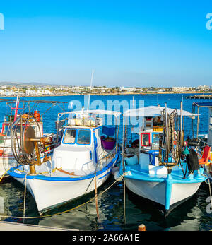 Typical colorful fishing boats moored in Paphos city harbor, sunlight, Cyprus Stock Photo