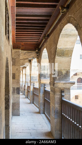 One of the arcades surrounding the courtyard of old historic public caravansary building - Wikala Bazaraa - Medieval Cairo, Egypt Stock Photo