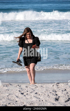 Tourists on the beach at Carmel by the Sea California USA Stock Photo
