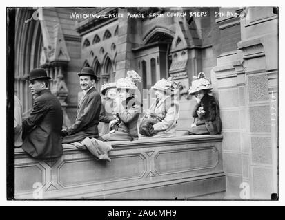 Watching Easter Parade from church steps, 5th Ave. Stock Photo