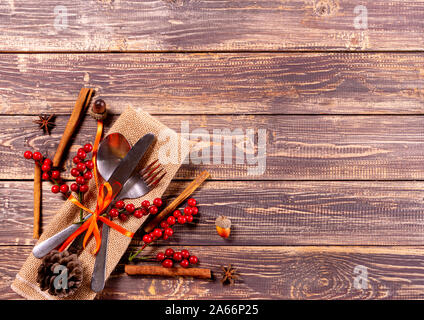 Thanksgiving dinner. Autumn fruit with plate and cutlery. Thanksgiving autumn background. Stock Photo