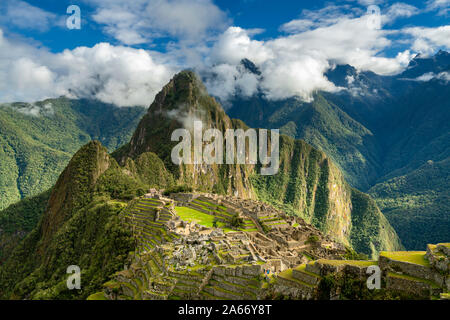 Historic ancient archeological Incan Machu Picchu on mountain in Andes, Cuzco Region, Peru Stock Photo