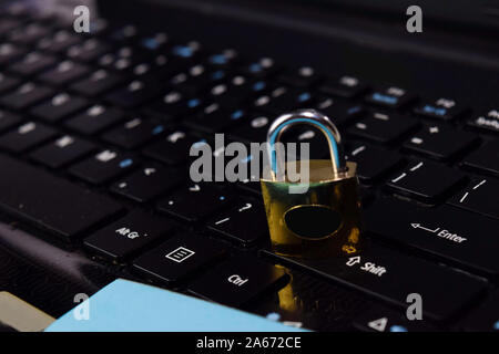 gold padlock. digital data protection isolated on laptop keyboard background. Security concept Stock Photo