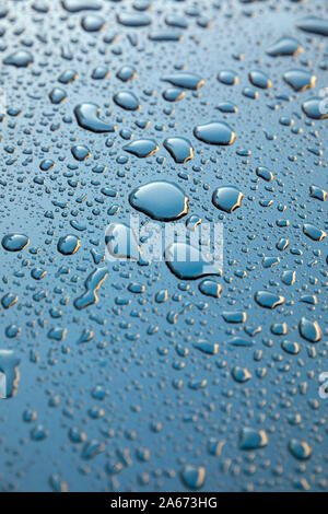 Water droplets on mertallic blue background Stock Photo