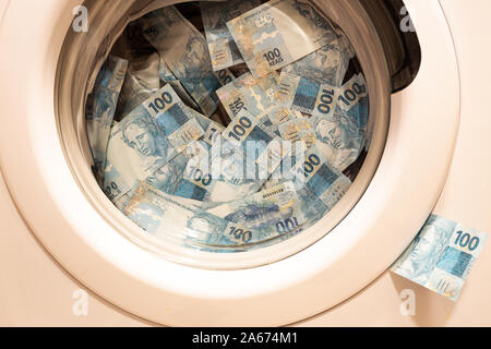 Brazil Machine Washing Brazilian money in the washing machine, the concept of money laundering ...