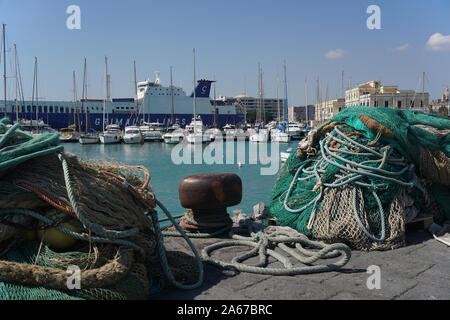 Fishing nets and floats on the dockside at a commercial dock Stock Photo