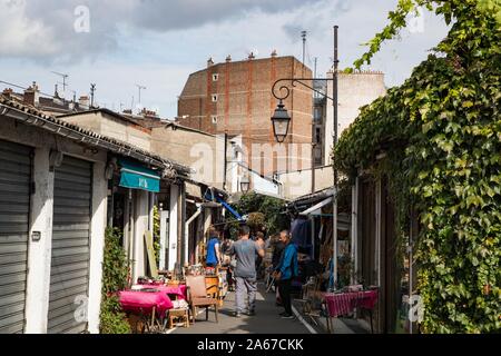 Paris, France- 30th September 2019: Alleyways and shops of the St-Ouen flea market in Paris, also known as Porte de Clignancourt flea market is one of Stock Photo