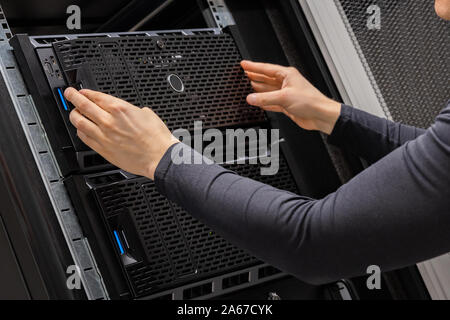 Hands Of Male Technician Installing Servers In Datacenter Stock Photo