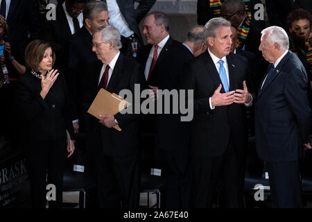 Washington, United States. 24th Oct, 2019. House Speaker Nancy Pelosi (D-CA) talks with Senate Majority Leader Mitch McConnell (R-KY) as House Minority Leader Kevin McCarthy (R-CA) talks with and House Majority Leader Steny Hoyer (D-MD) before the start of a memorial service for late Maryland Representative Elijah Cummings in National Statuary Hall at the U.S. Capitol in Washington, DC on Thursday, October 24, 2019. Cummings died at the age of 68 on October 17 due to complications concerning long-standing health challenges. Pool Photo by Erin Schaff/UPI Credit: UPI/Alamy Live News Stock Photo