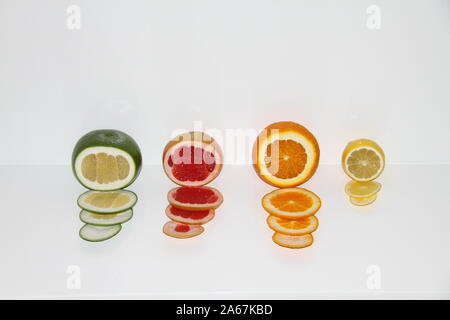 Citrus fruits on white background: grapefruits, orange and lemon. Stock Photo