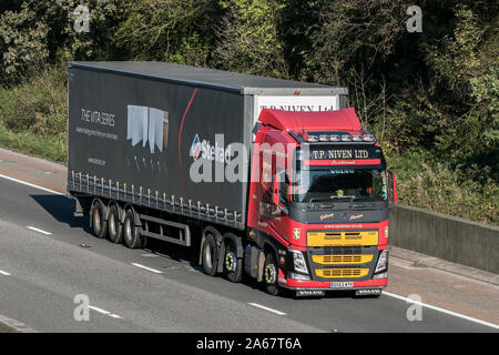 A T P Niven Scotland transport curtain sided articulated Volvo Globetrotter semi truck traveling on the M6 motorway near Preston in Lancashire, UK Stock Photo