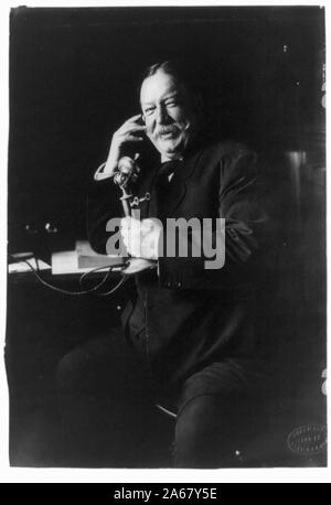 William Howard Taft, three-quarter-length portrait, seated facing left, on telephone] / copyright by Harris & Ewing Stock Photo