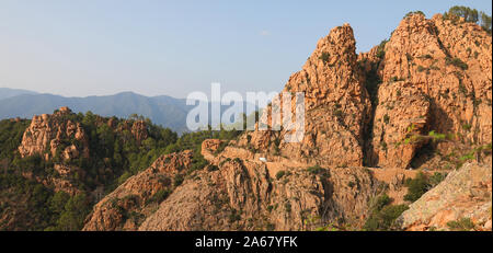 red rock at sunset in Corsica Island called Les Calanches in french language and the road called D81 Stock Photo