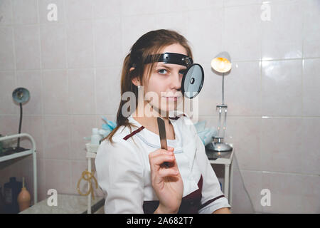 Female medicine doctor examining patient. Healthcare, medical service and insurance concept. Otorhinolaryngologist or ENT examination. Stock Photo