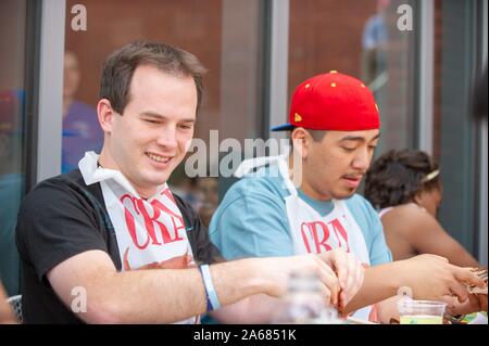 Students participate in a crab feast with the traditional Maryland dish of blue crabs, on the Homewood Campus of the Johns Hopkins University in Baltimore, Maryland, May 21, 2010. From the Homewood Photography collection. () Stock Photo