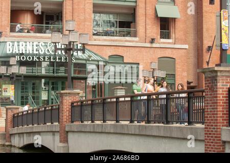 Johns Hopkins University Students Walking On The Paved Path Next