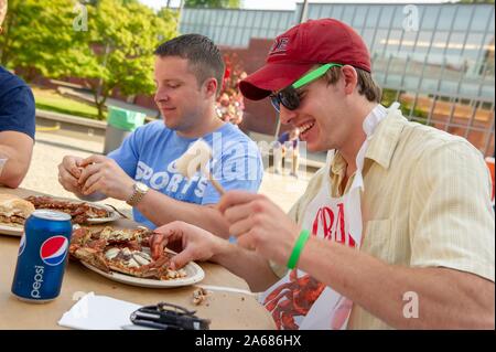 Students participate in a crab feast with the traditional Maryland dish of blue crabs, on the Homewood Campus of the Johns Hopkins University in Baltimore, Maryland, May 21, 2010. From the Homewood Photography collection. () Stock Photo