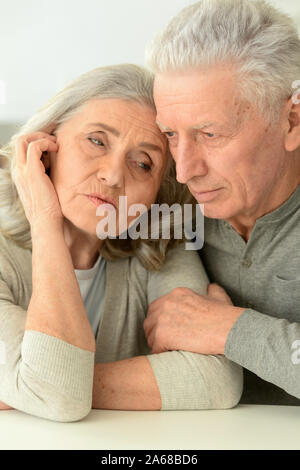 Close up portrait of sad senior couple Stock Photo