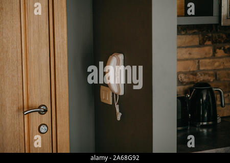 Intercom on the wall in a residential apartment. Stock Photo