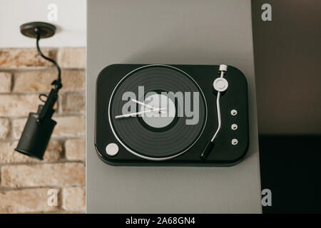 Clock on the wall in a residential apartment Stock Photo
